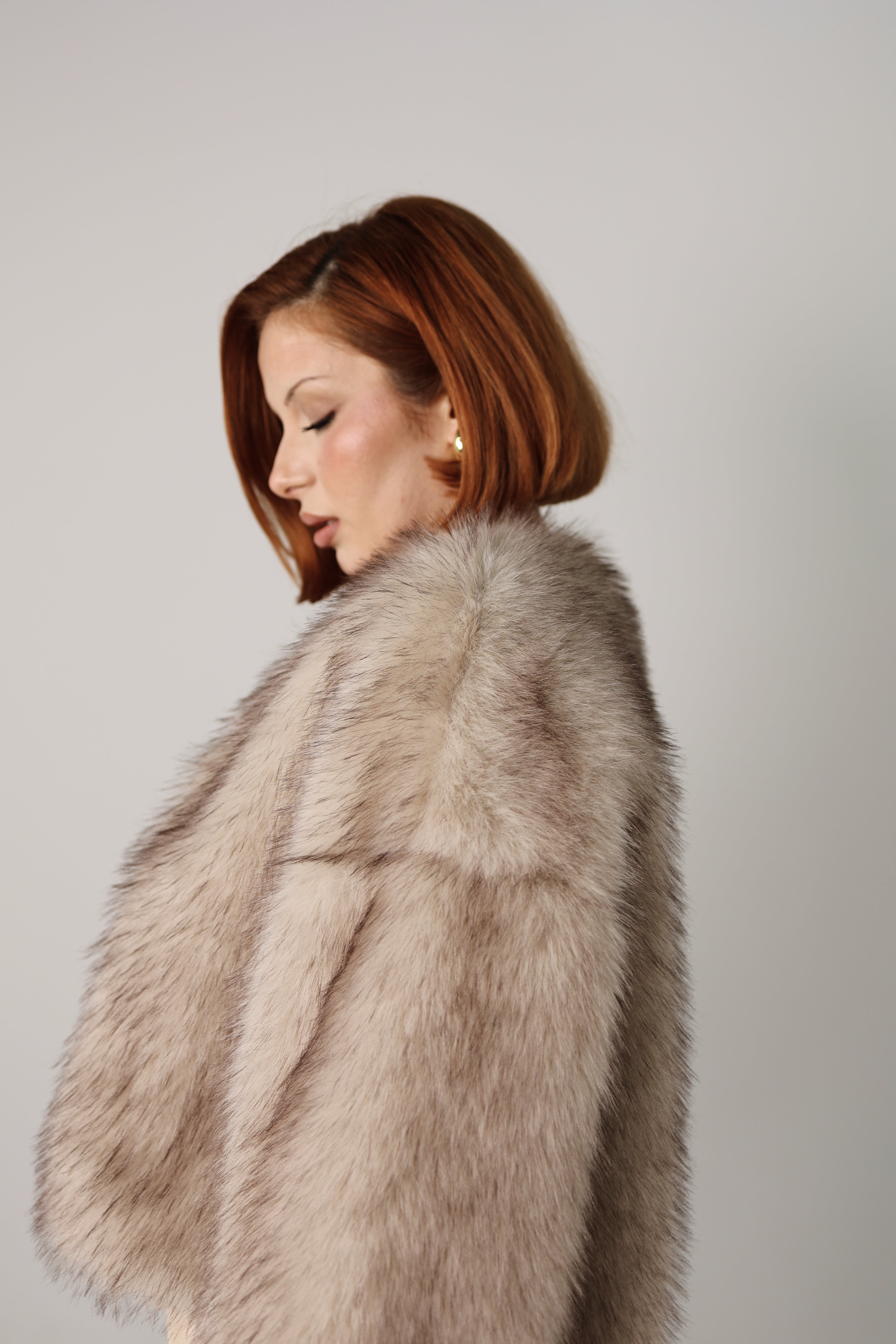Manteau court effet fourrure