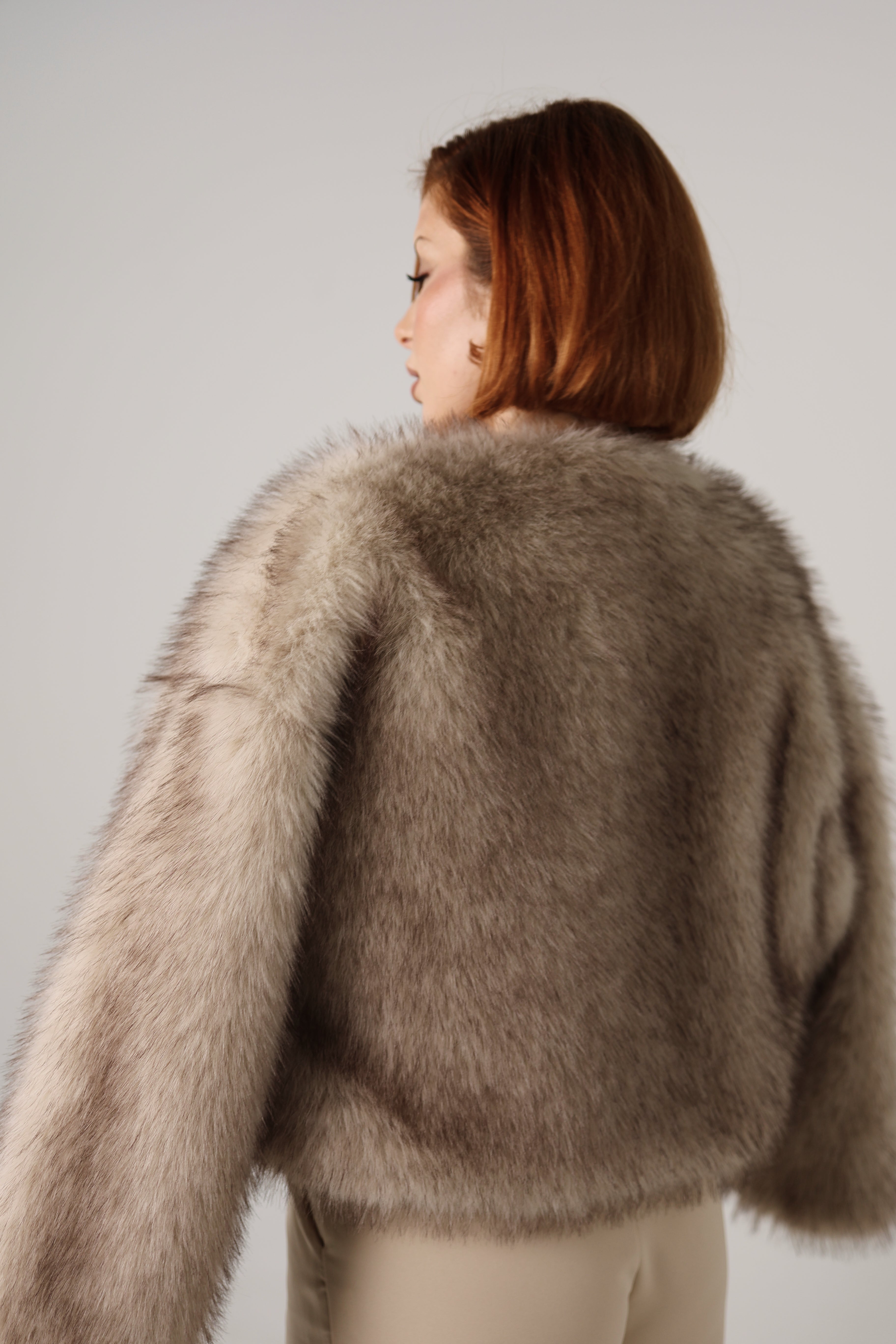 Manteau court effet fourrure